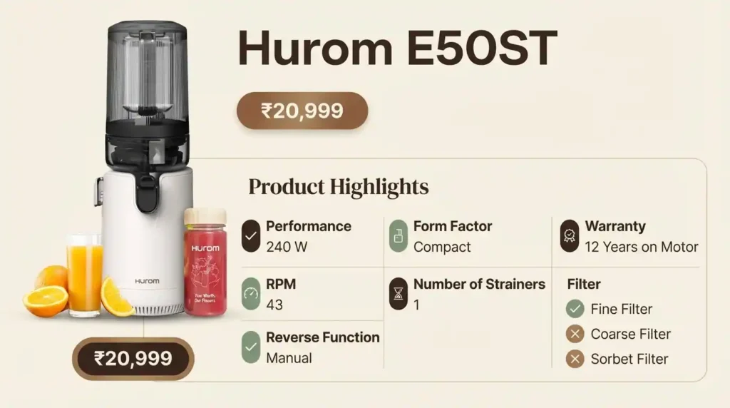 A photo of the metallic silver Hurom E50ST hands-free cold press juicer with a dual feeding hopper, actively producing green juice on a kitchen counter with fresh produce.