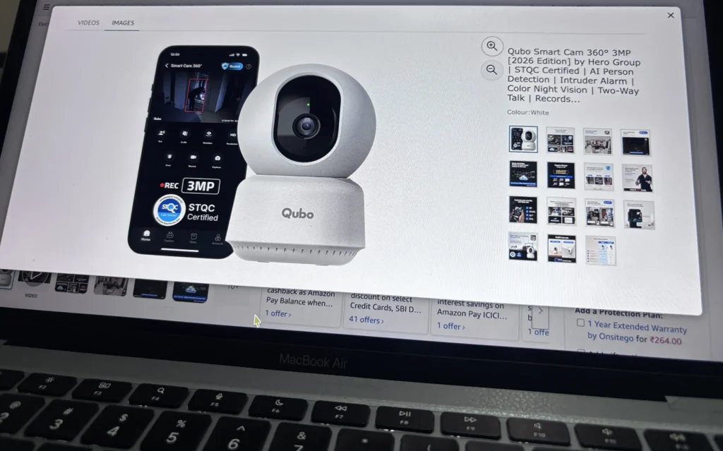 Product listing page displaying a smart indoor security camera with feature highlights and promotional images on a laptop screen.
